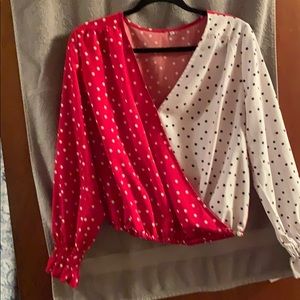 Red, white blouse with black and white polka dots